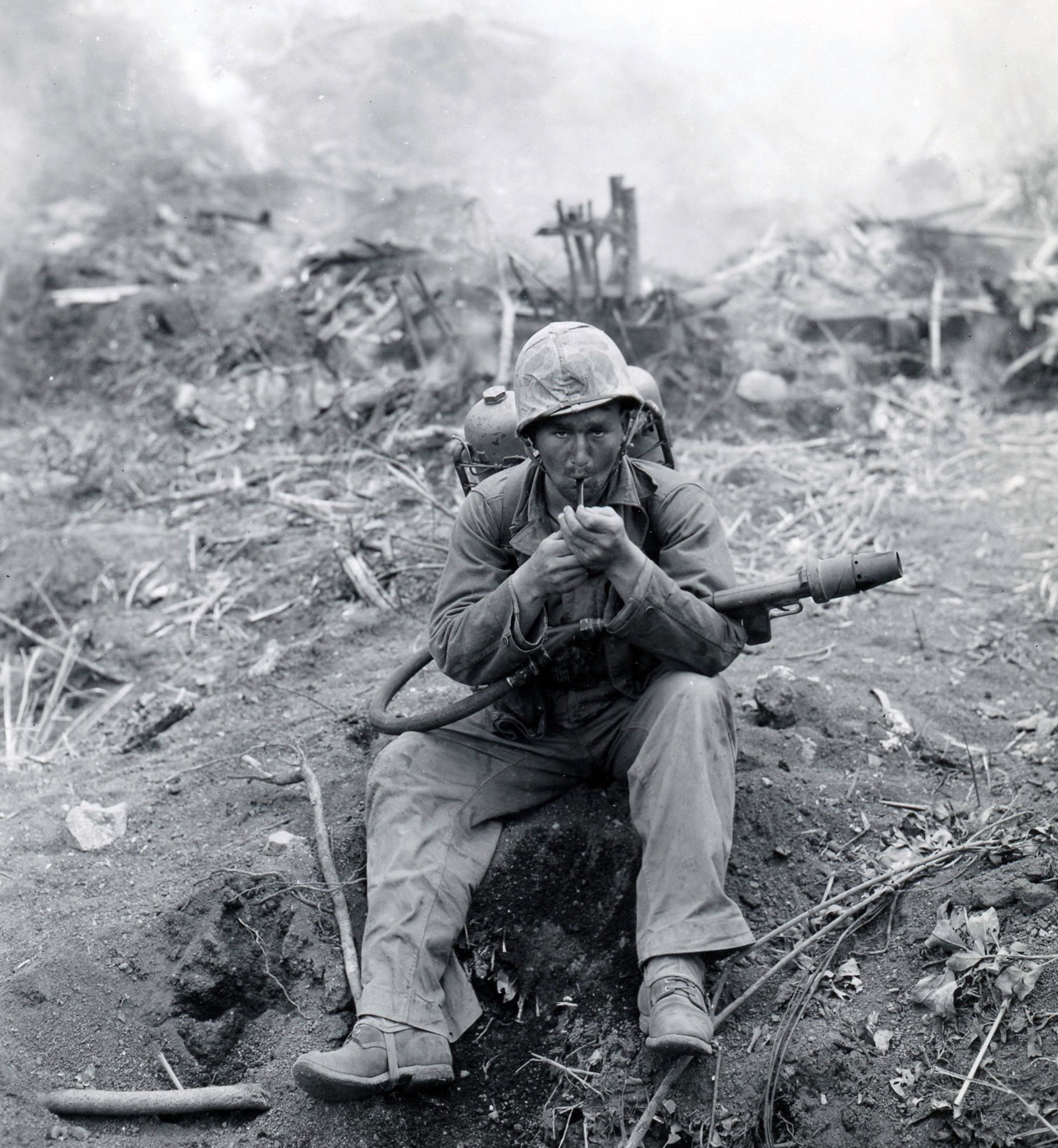 marine flame gunner smoking a pipe on iwo jima