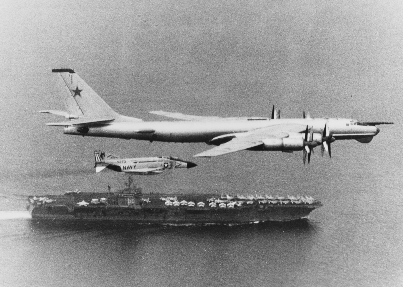 soviet tu-95 bear escorted by f-4j over the uss nimitz
