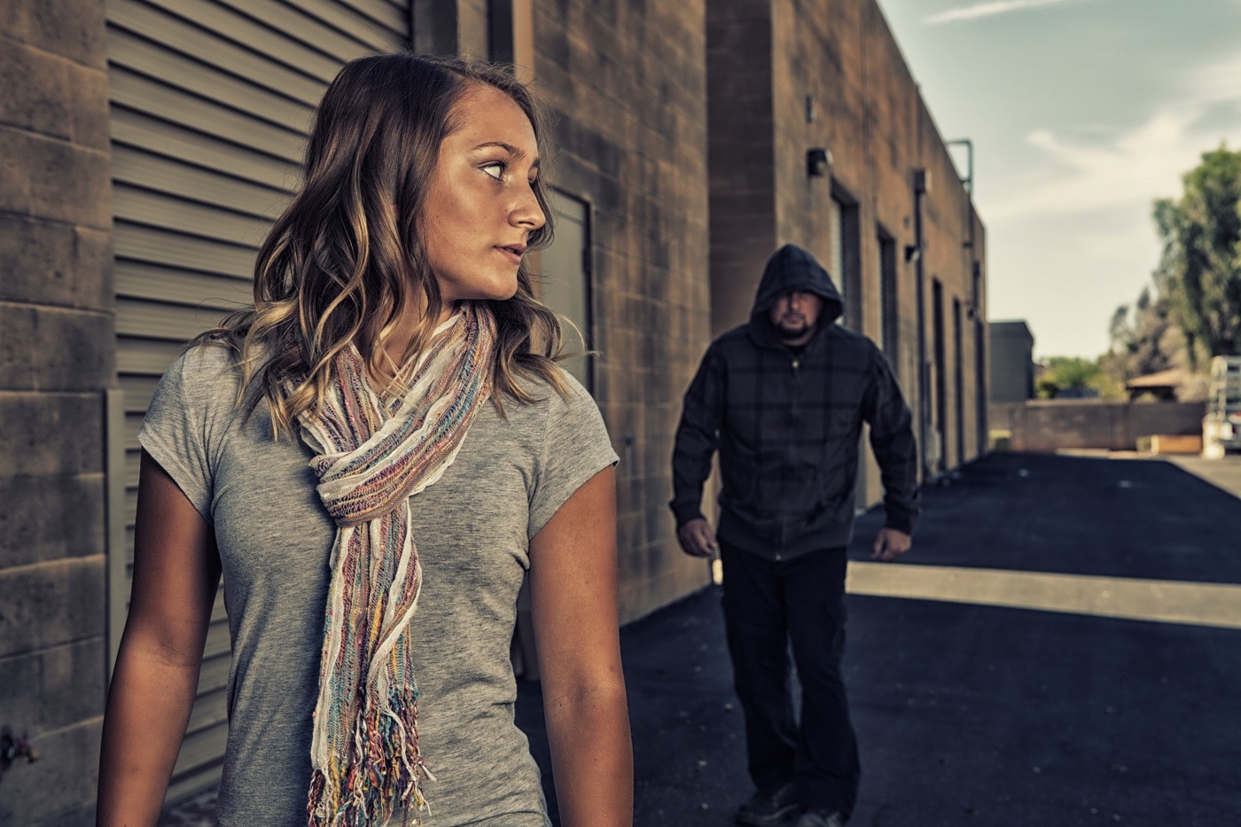 woman being followed by an attacker