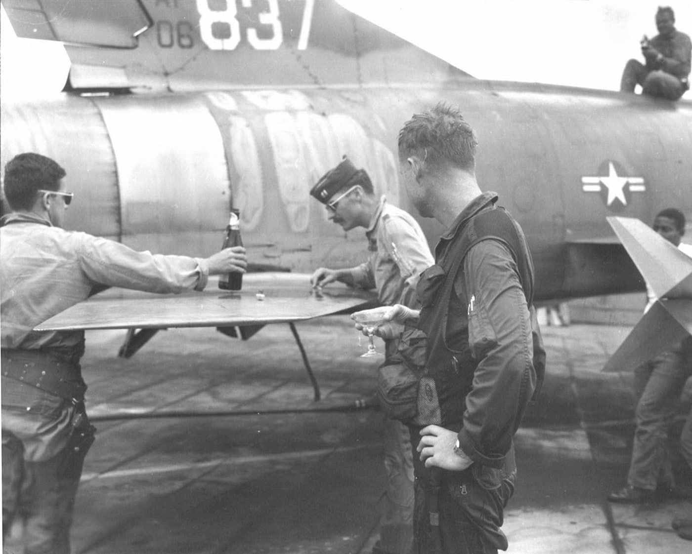 damaged by aa fire flak f-100f pilot celebration champagne missions mechanic