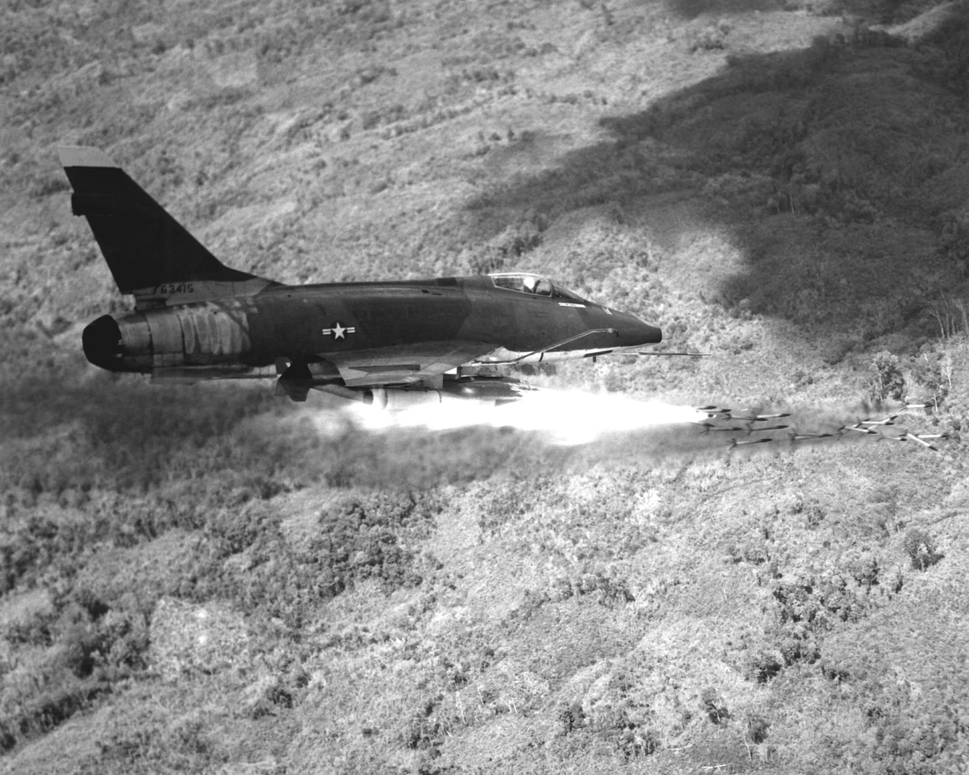 f-100d super sabre launches rockets at nva and vc in south vietnam strafing attack
