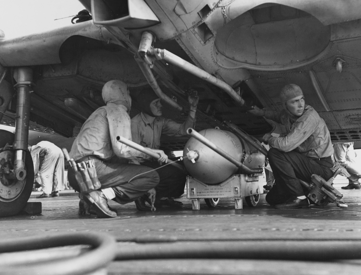 loading 500 pound bomb on sbd dauntless