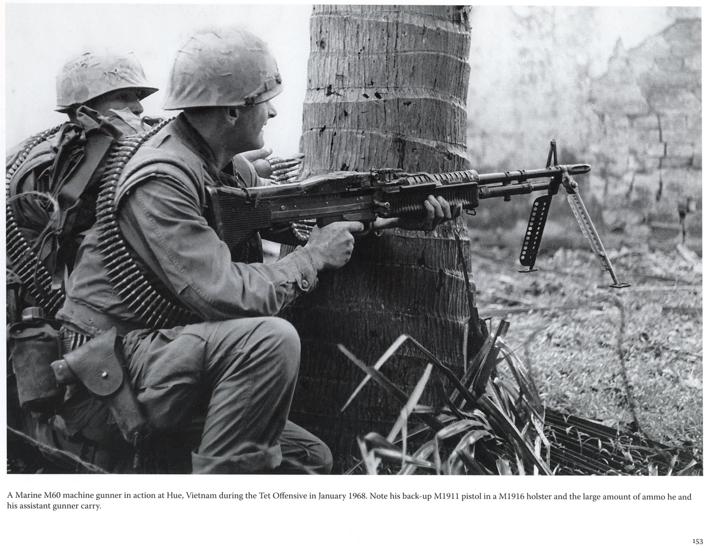 m60 gunner with 1911 pistol in the vietnam war shooting at vc