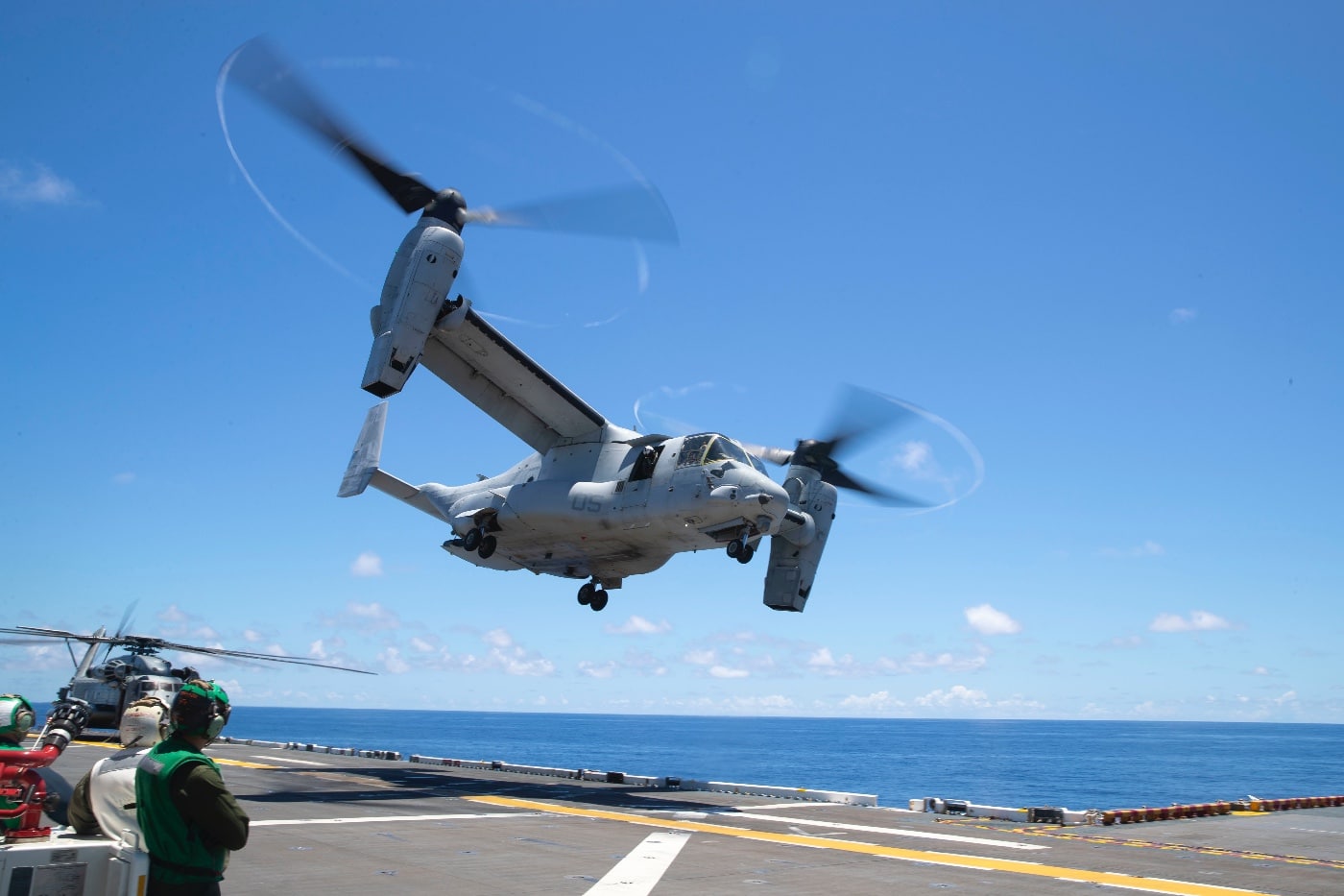 mv-22 osprey tiltrotor aircraft with marines takes off from uss tripoli