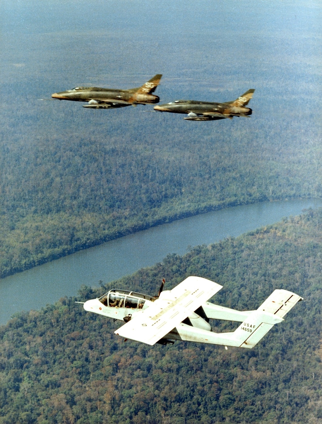 ov-10a bronco and two f-100c super sabres over vietnam