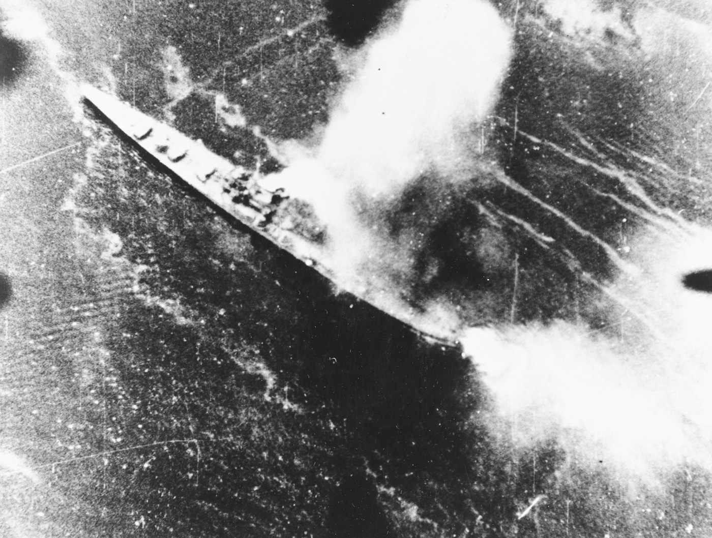 sbd bomber attacks a japanese cruiser at rabaul 1943