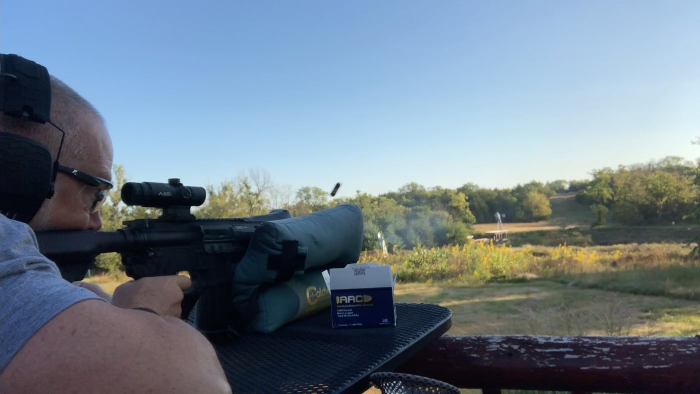 testing the effective range of 9mm ammo ammunition cartridge on the range with an ar-15 rifle carbine gun arm