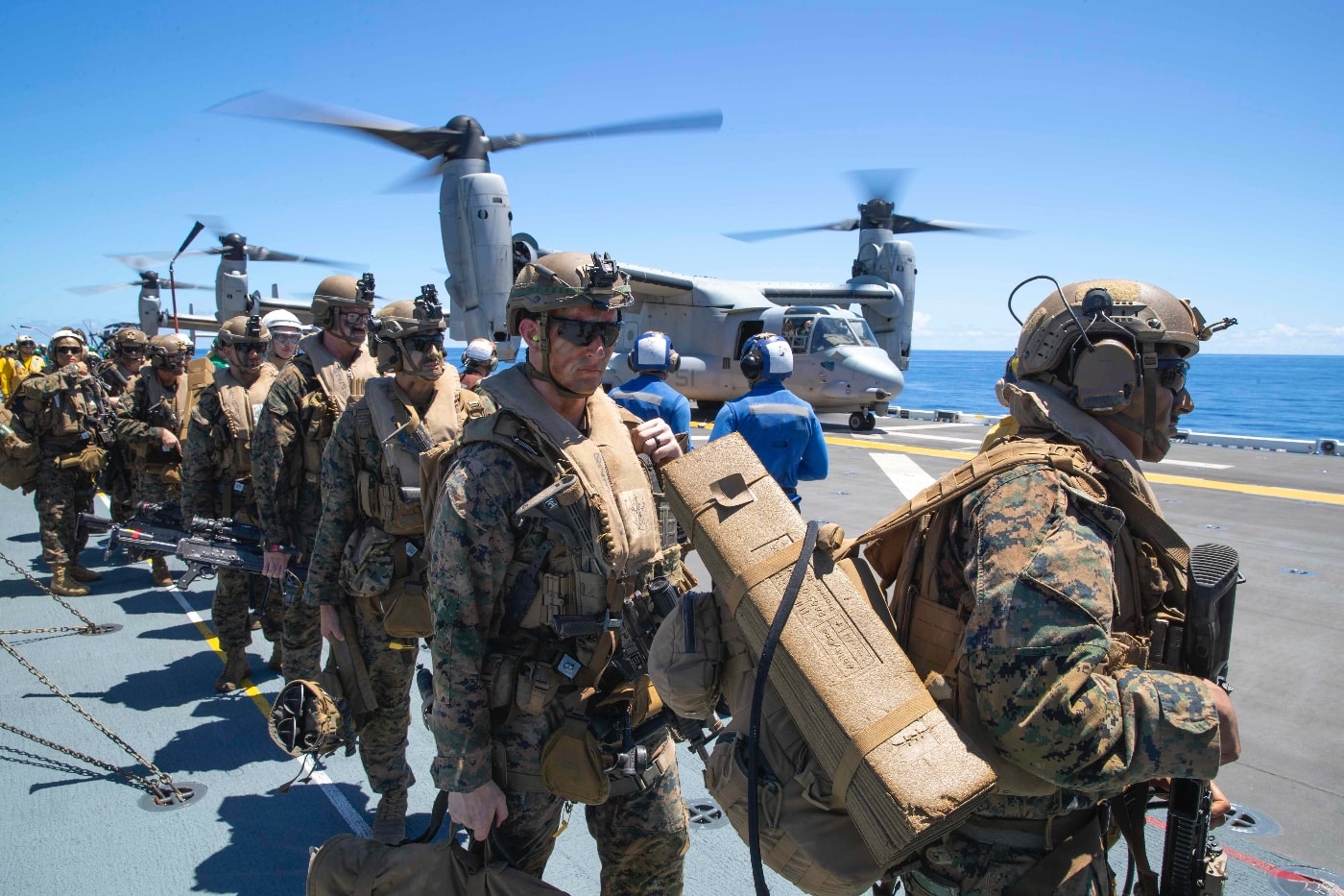 us marines board mv-22 osprey tiltrotor aircraft on uss tripoli