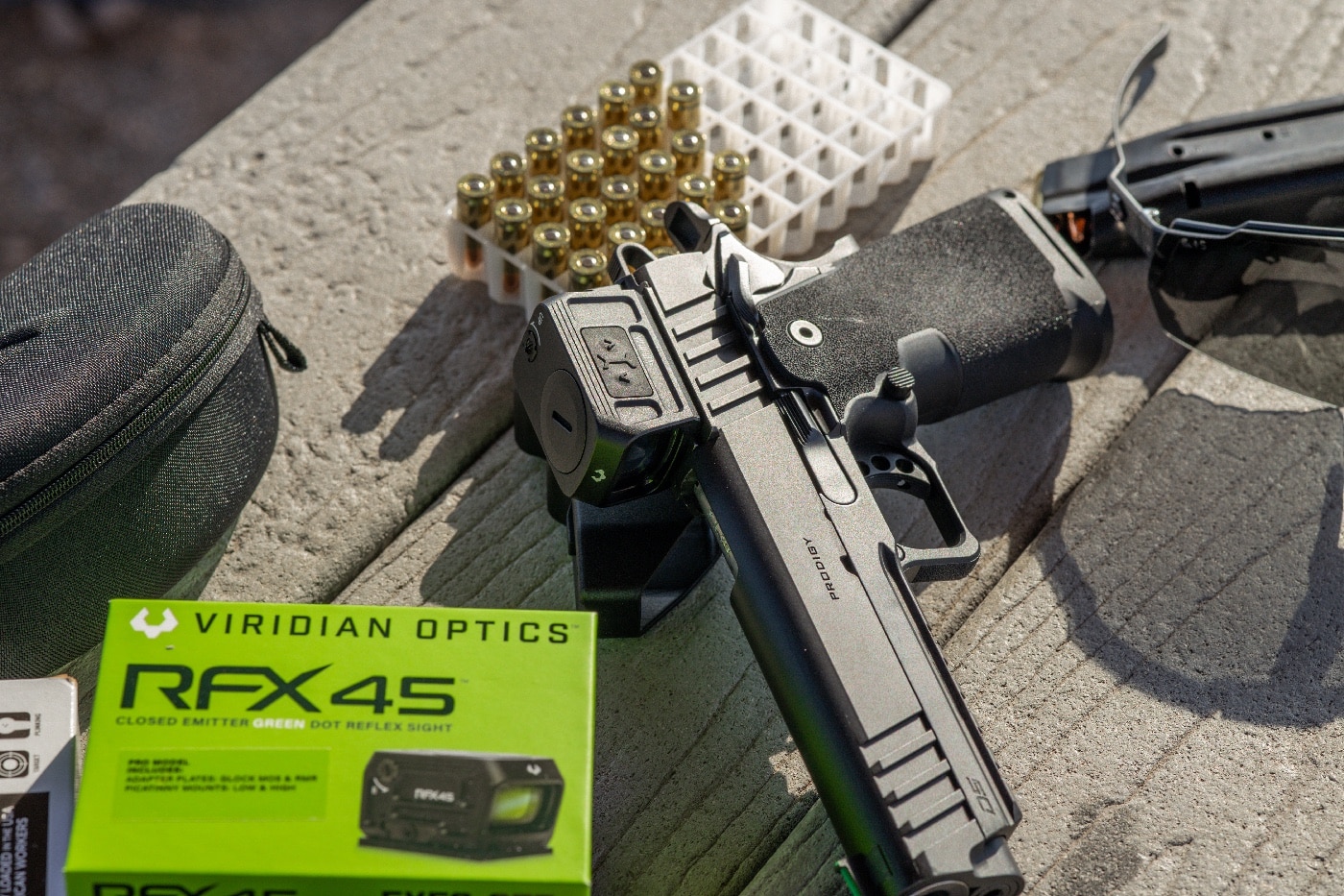 viridian closed emitter green dot sight mounted on 9mm handgun on the range testing