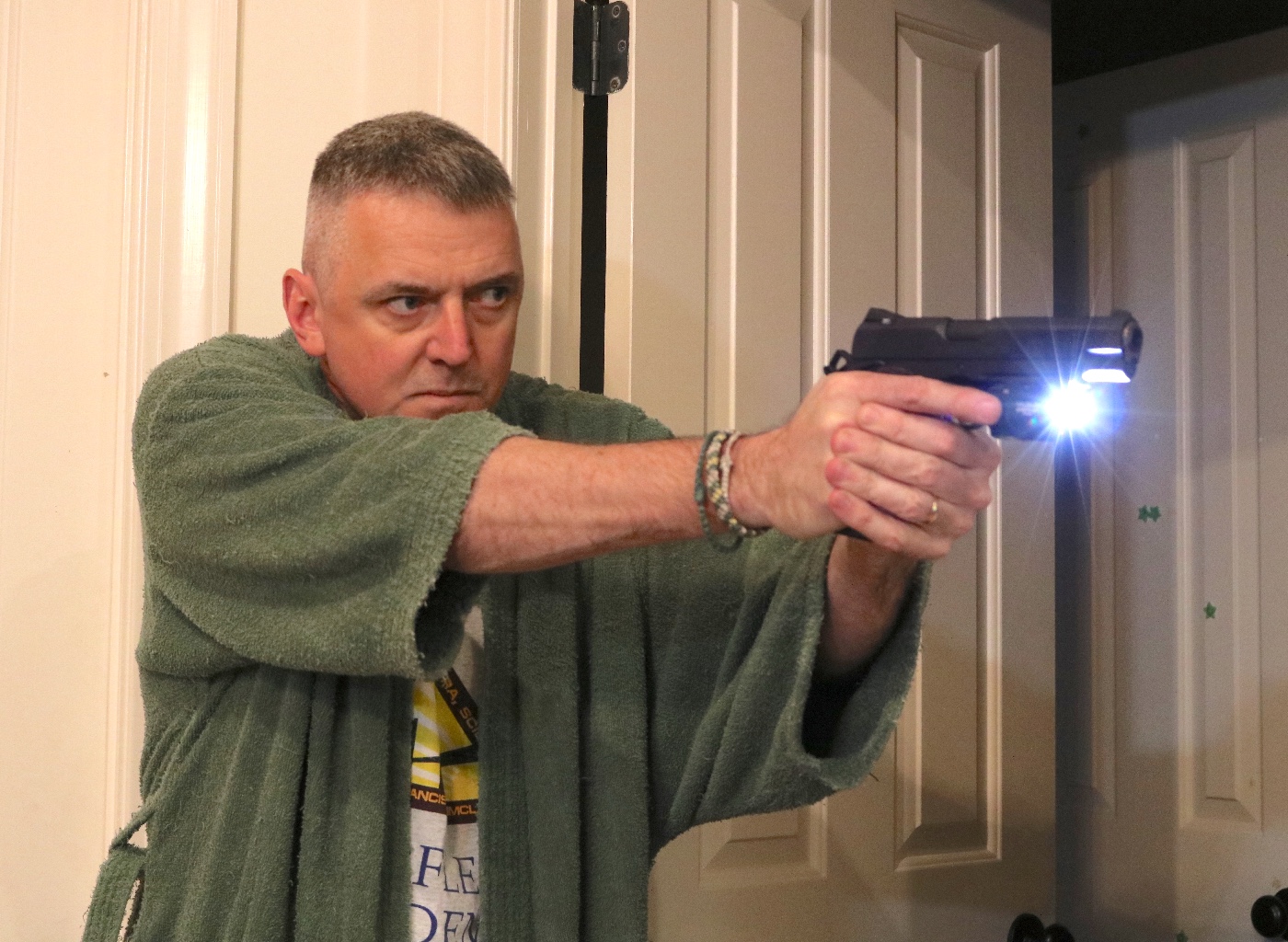 author using a 1911 pistol for home defense weapon mounted light single action 45