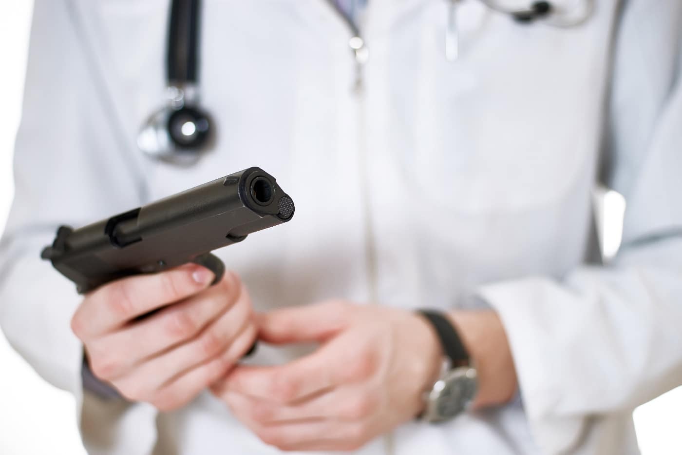 doctor in white coat carrying a 1911 pistol 45 acp