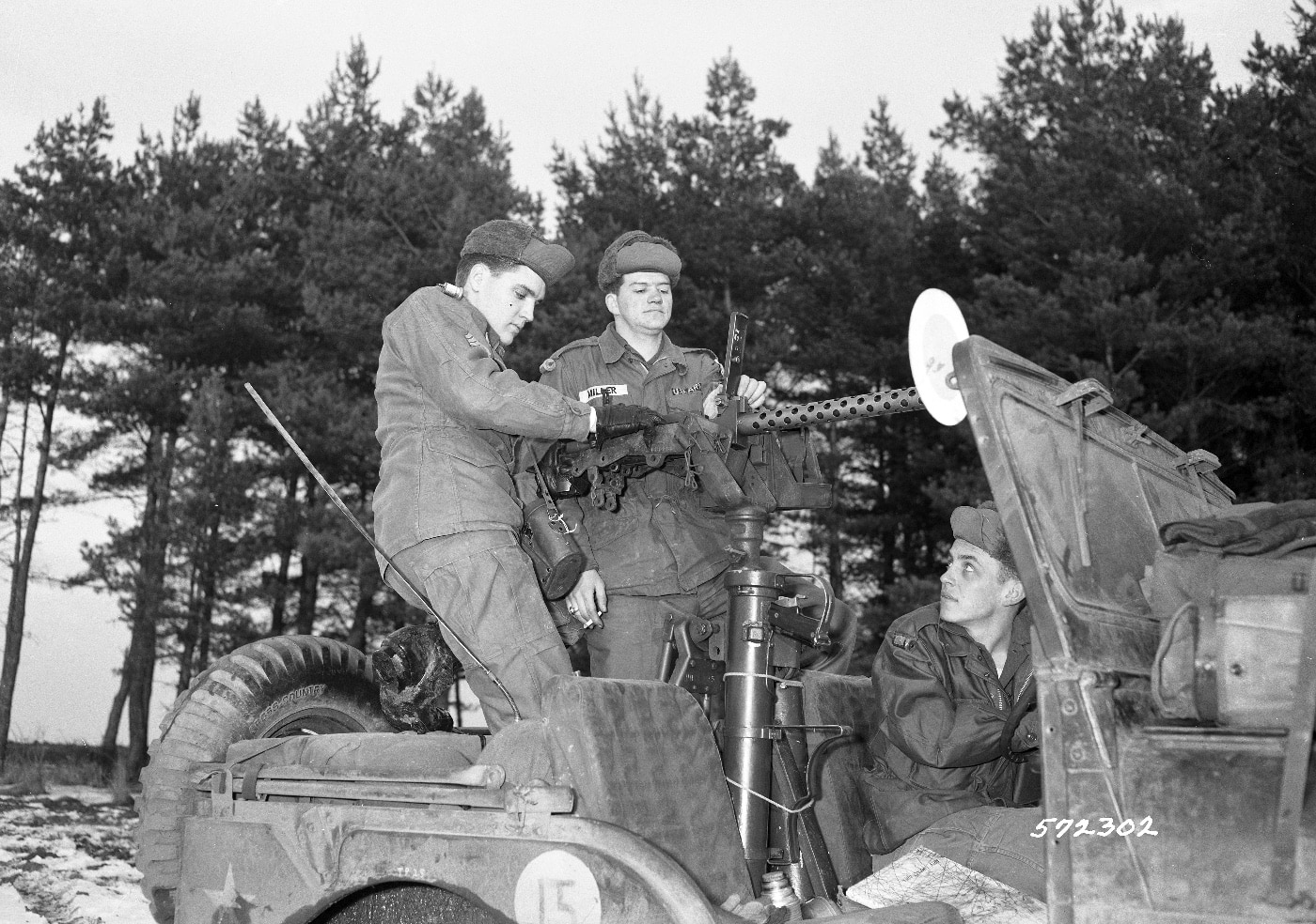 elvis presley with 30 caliber machine gun and super bazooka in jeep west germany