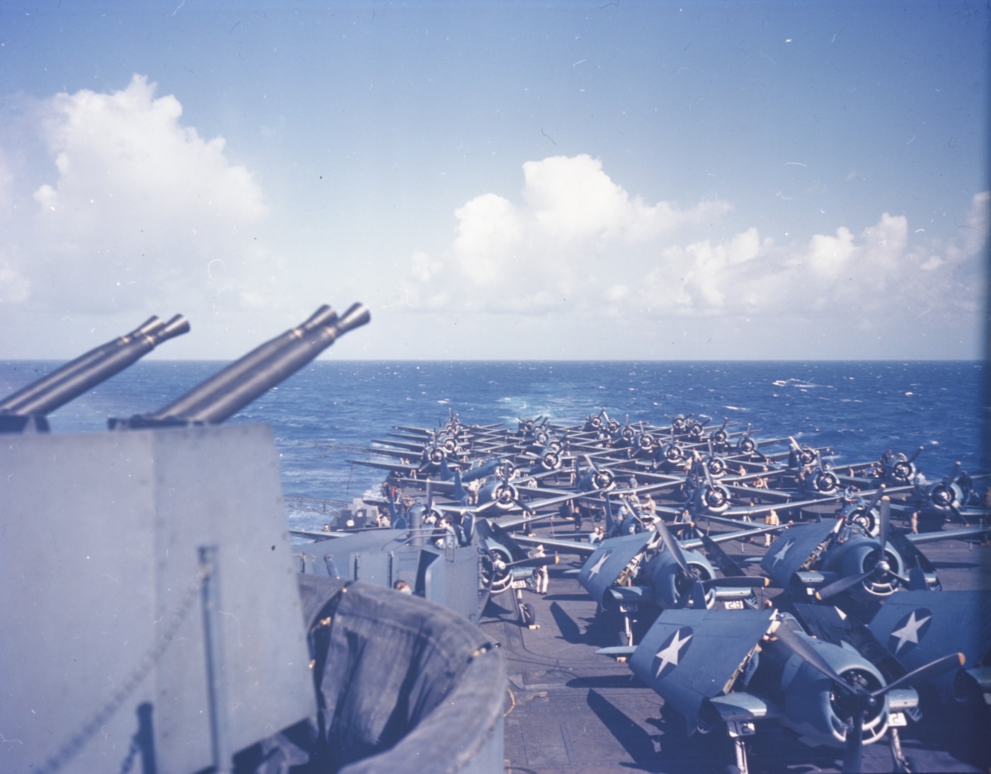 f6f-3 hellcats and sbd-4 dauntless dive bombers on desck of uss essex