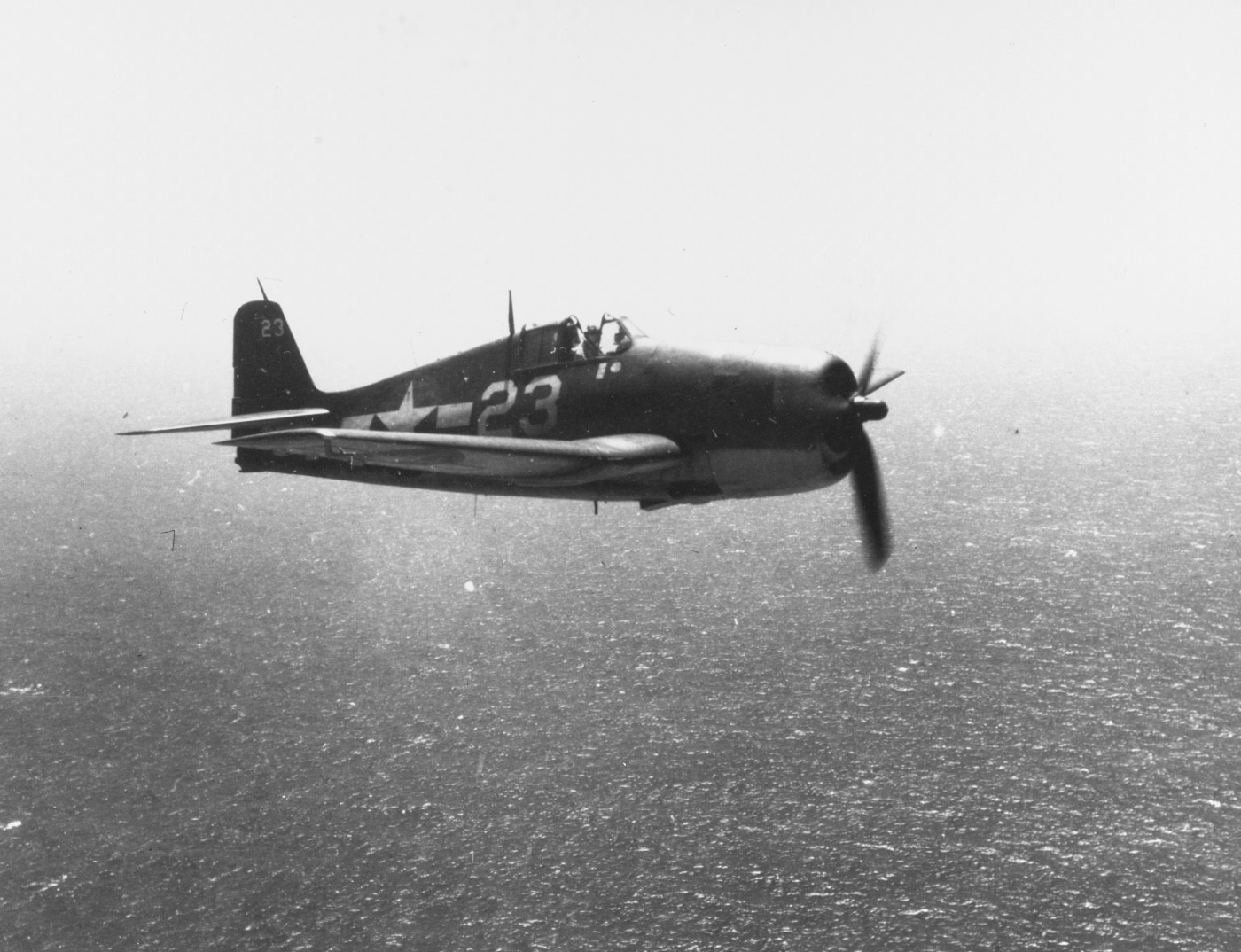 f6f in flight over pacific ocean in 1943 during world war 2