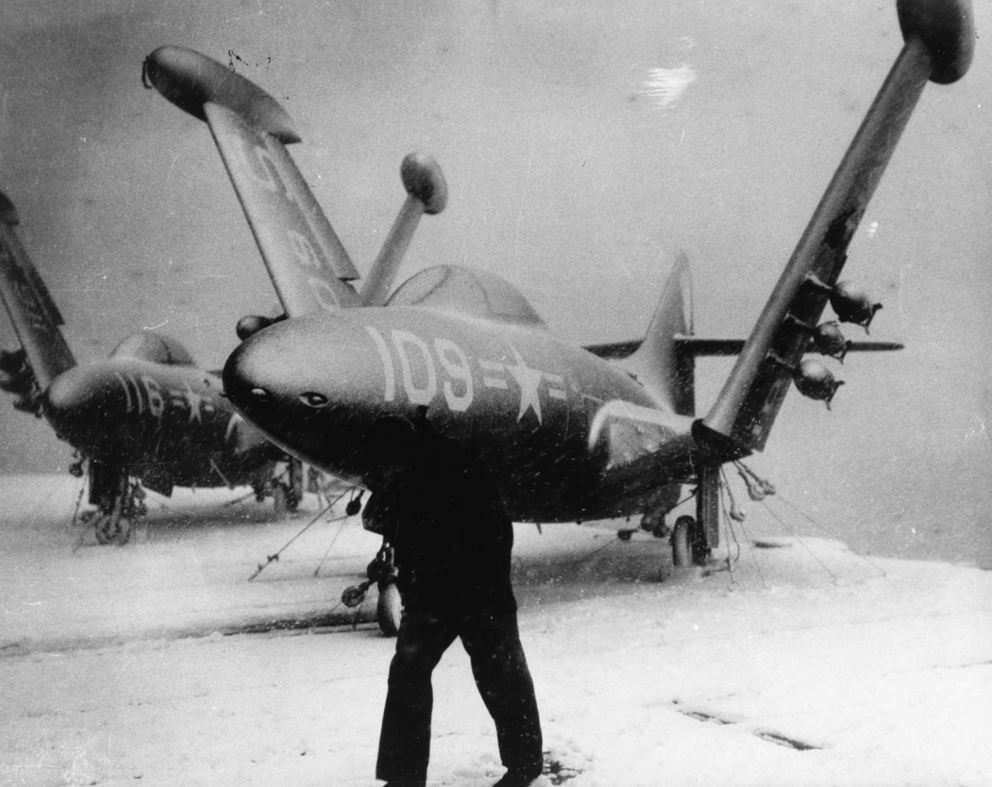 f9f panther jets covered in snow on uss essex cv-9 during korean war