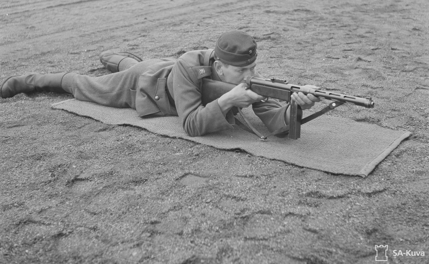 finland army soldier demonstrates teaches shooting with suomi kp -31 smg submachine gun 9mm gun carbine