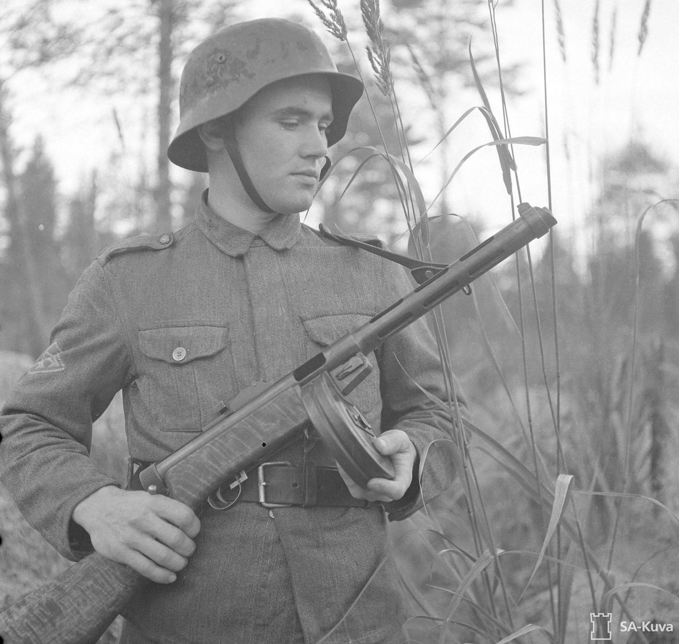 finnish soldier in continuation war armed with 9mm suomi smg 71 round magazine vented barrel