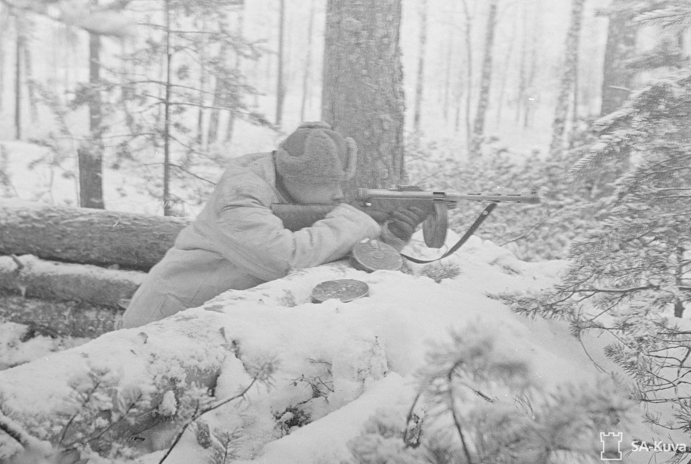 finnish soldier in defensive position with suomi kp -31 model 1931 smg sub machine gun ostrobothnia snow entrenched fortified