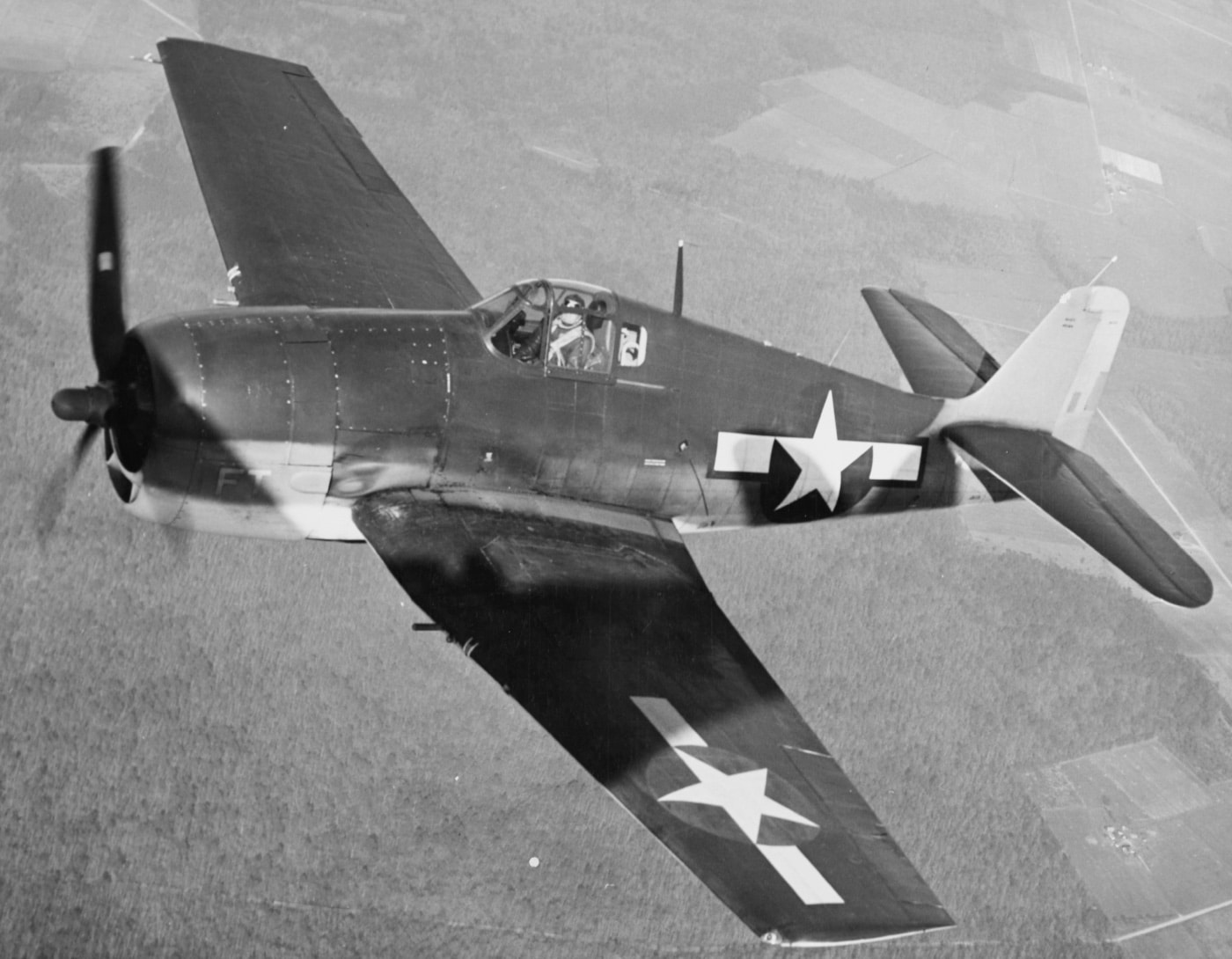 grumman f6f hellcat in flight over nas patuxent river maryland