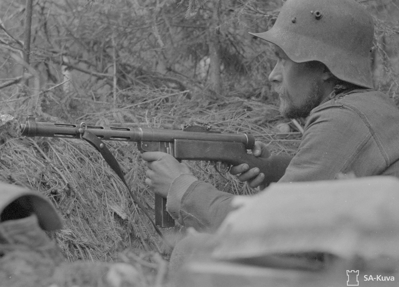 soldier armed with suomi kp -39 smg 9mm machine gun waiting to ambush soviet union troops