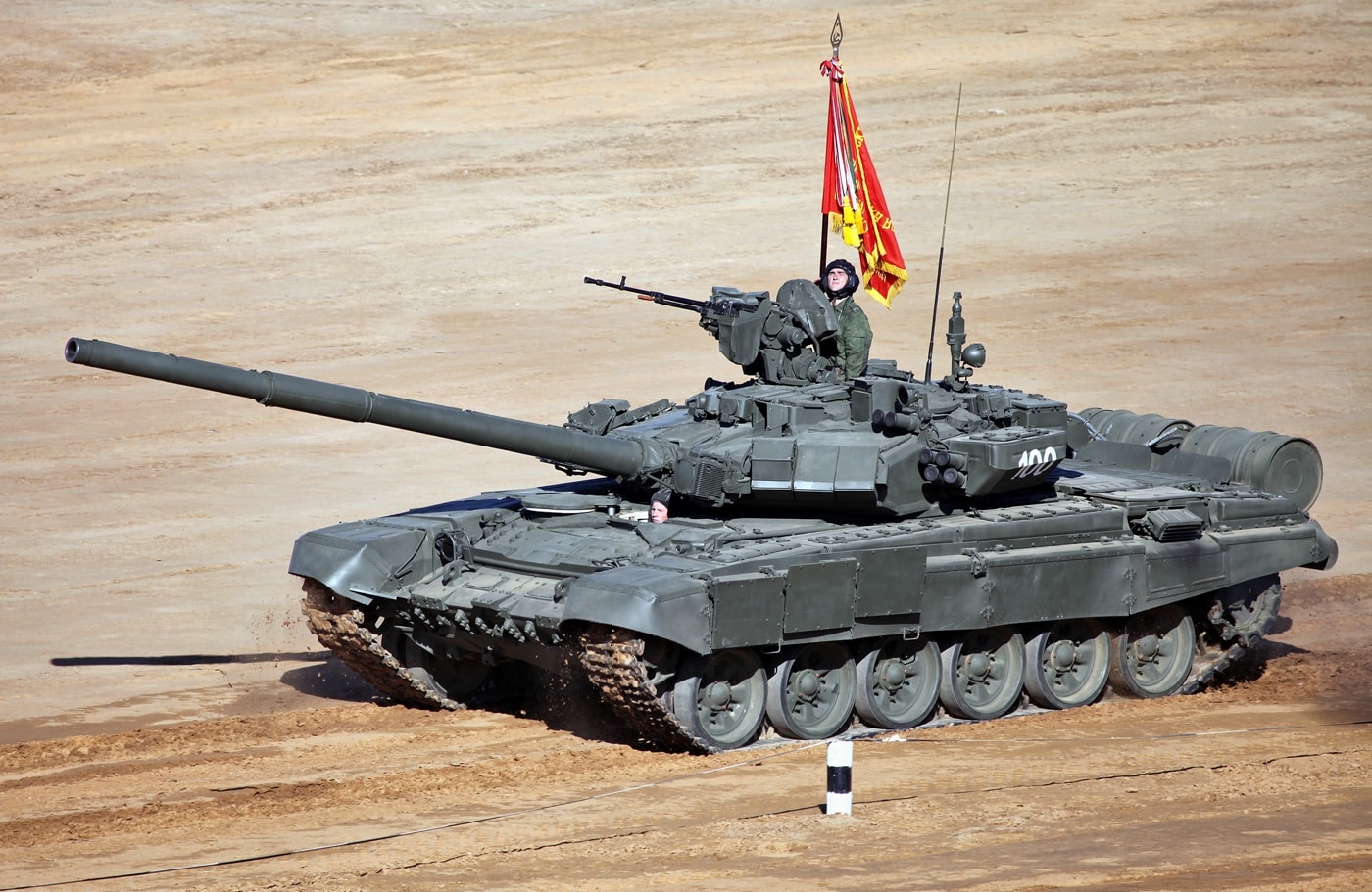This Russian T-90 main battle tank participates in a 20213 armored vehicle competition. The three man tank crew is visible.