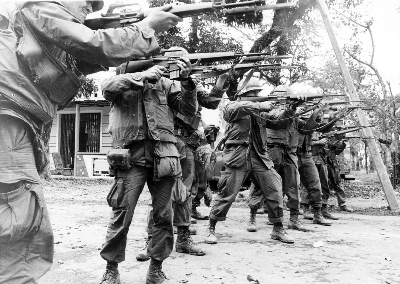 Marines advancing and firing down a street in Huế’s Citadel on February 21, 1968. With the exception of a single XM16E1, they are armed with the M16A1 rifle.    CSU Archives/Courtesy Everett Collection