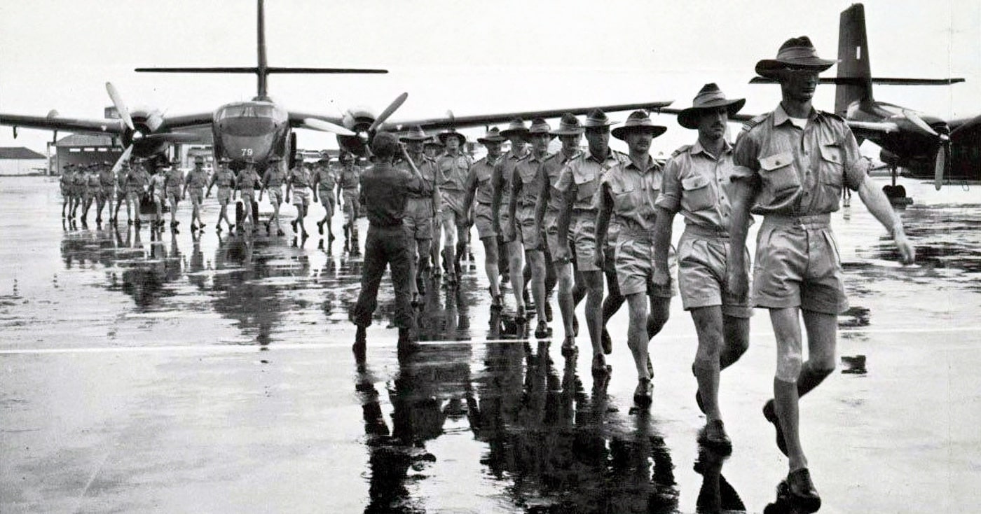 This image shows Australian military members — pilots and plane maintenance crews — arriving in South Vietnam in support of the United States and government of South Vietnam. Ho Chi Minh forces were becoming much bolder by 1965 when these Aussies arrived. The image is from the U.S. National Archives.