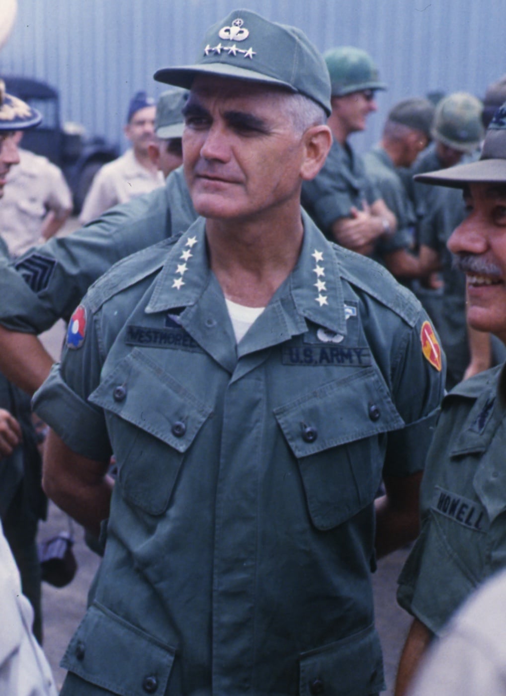 This is a photo of U.S. General William C. Westmoreland watching the arrival ceremonies for the Queen's Cobra, the Royal Thai Volunteer Regiment in Vietnam. Taken in 1967, the photo showed the cooperation between all of the allied forces during Hanoi's war on its souther neighbor. Thai troops were said to be some of the hardest fighters during the guerrilla war.