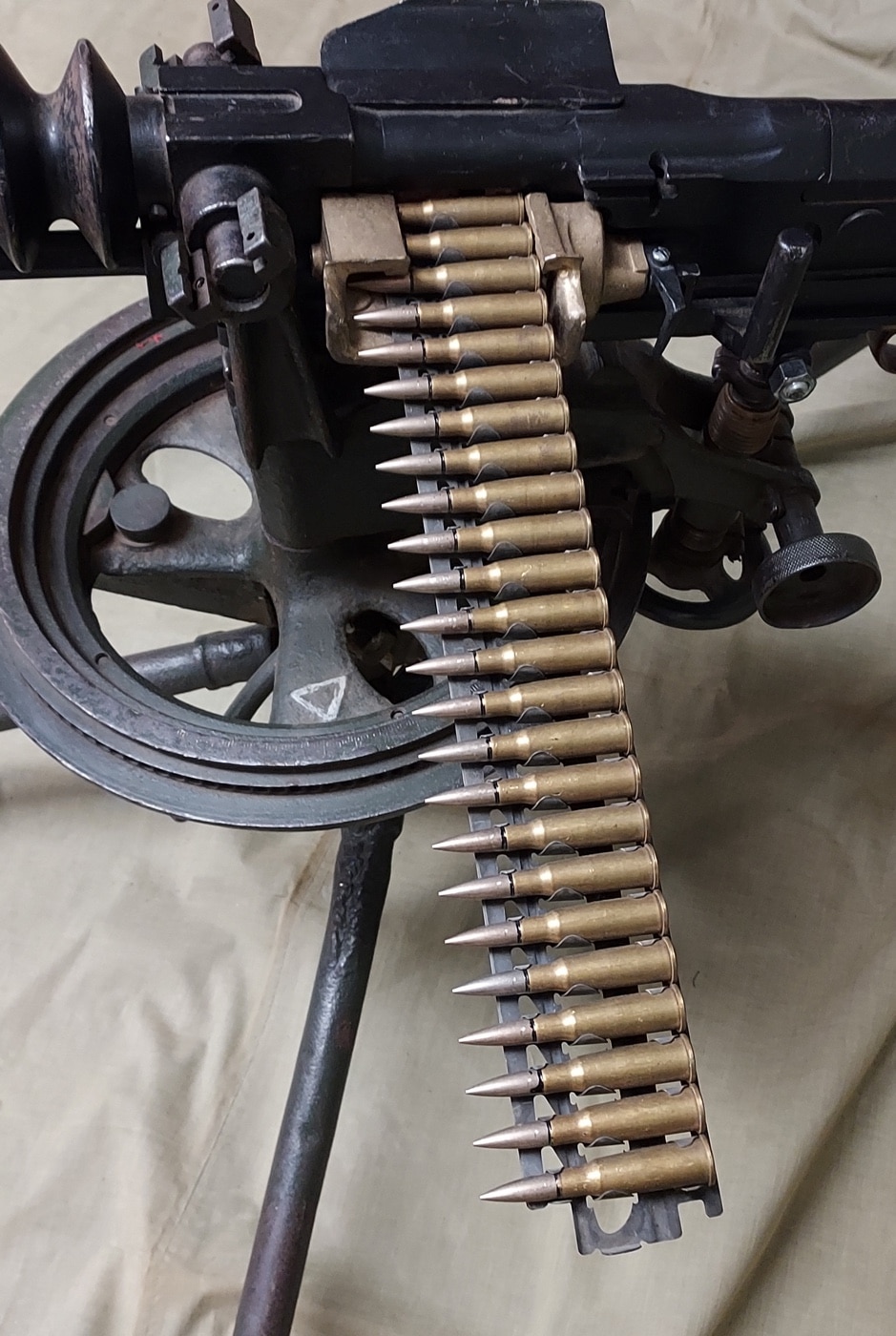 This image shows how the Hotchkiss metal feed strip loads ammunition into the gun. The photo shows how the Lebel cartridges are loaded into the strip and then fed into the weapon.