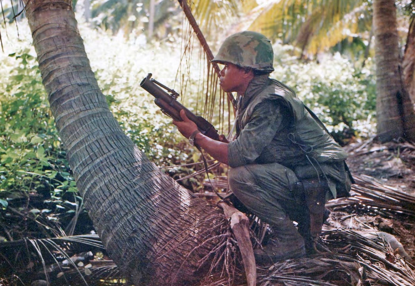 Part of the Queen's Cobras, this Thai soldier is part of a "sweep and clear" mission in Vietnam near Phuoc Tho in 1967. He is armed with M79 grenade launcher. Image: NARA