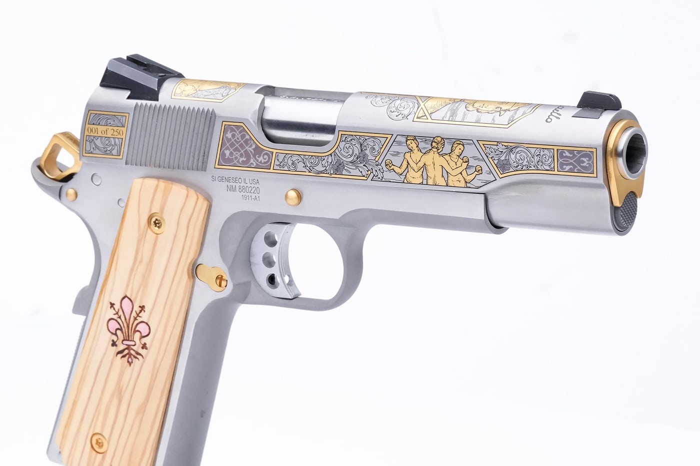 Three Graces reproduced on the slide of a 1911 pistol chambered for the .45 ACP cartridge. Scrollwork engraved into the slide with gold tones.