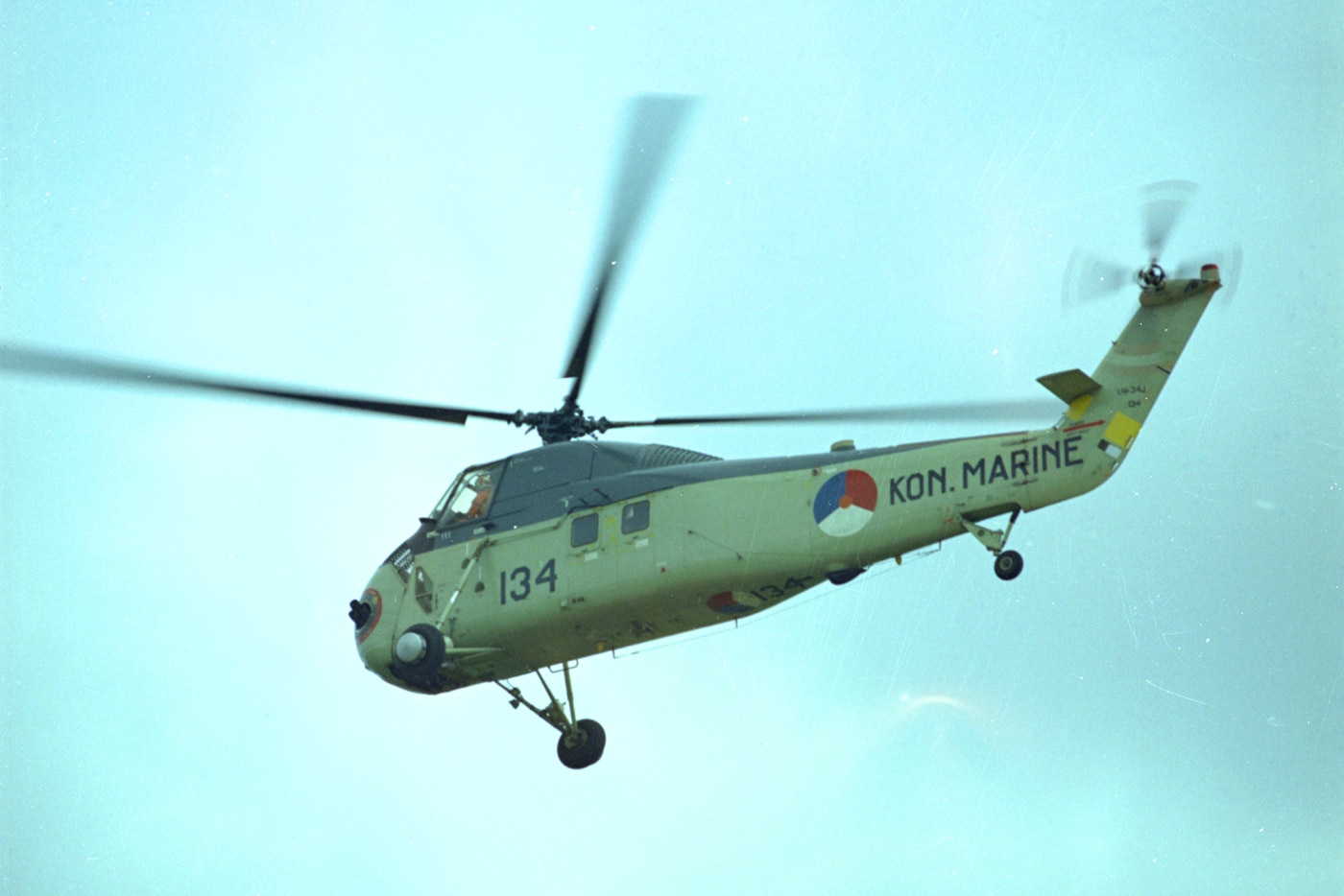 A Royal Netherland Marine H-34 is shown in this color photograph. The H-34 was the last piston-engined helicopter used in combat operations by the US military.