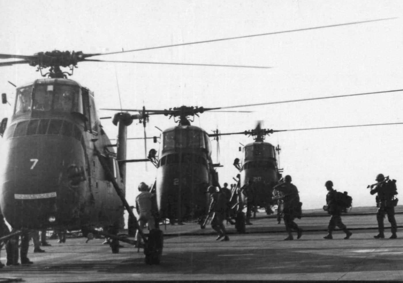 In this black and white photograph, American Marines load into CH-34D helicopters for Operation Kentucky against North Vietnam. The Army frequently used the UH-1 and Chinook helicopters in Vietnam instead of the CH-34. The heat was said to be too much for the H-34 engines. However, the H-34 remained in service with the U.S. Marines and the South Vietnamese Air Force. The helicopters also saw service in other hot climates such as with the French during the war in Algeria. 