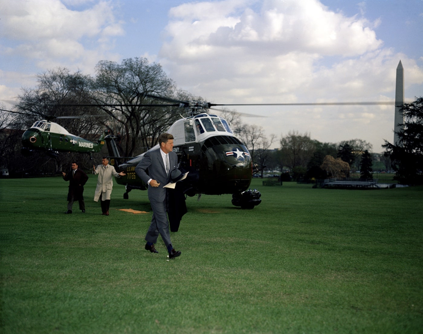 In this photo, President John Kennedy walks across the White House lawn after taking helicopter from Andrews Air Force Base. The VH-34D (later designated the HUS-1Z) was a version of the H-34 designed for transporting the United States President and other dignitaries like the First Family, Secretary of Defense, Secretary of State and others. 