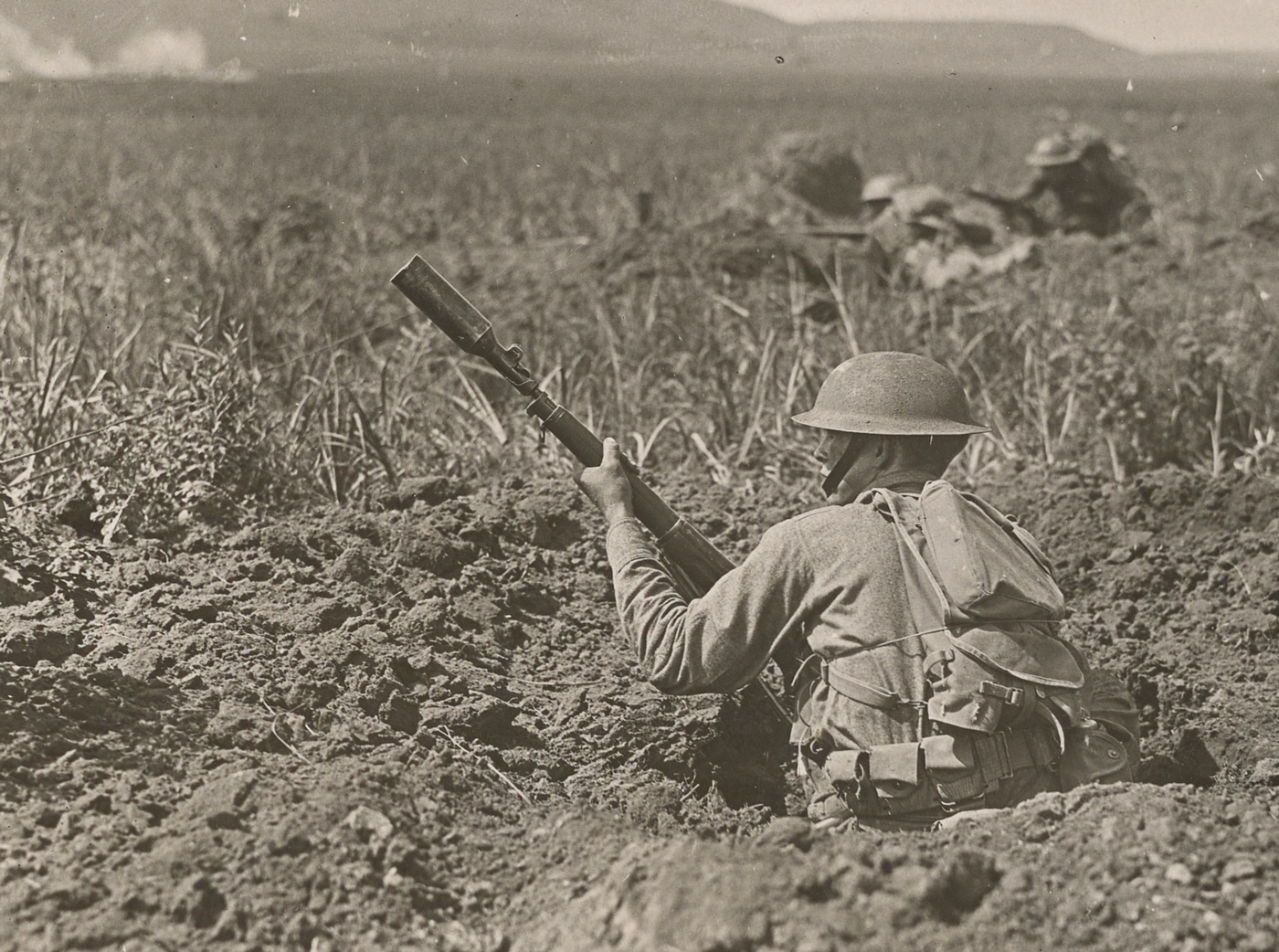 This photo shows a U.S. Army private practicing with a rifle grenade prior to shipping out to the Western Front. The United States used the V.B. rifle grenades and launchers for the Model 1903 and Model 1917 bolt action rifles that were standard issue to American soldiers. These rifle grenade launchers attached to the muzzle of the rifle barrels to provide extra range as compared to thrown hand grenades.