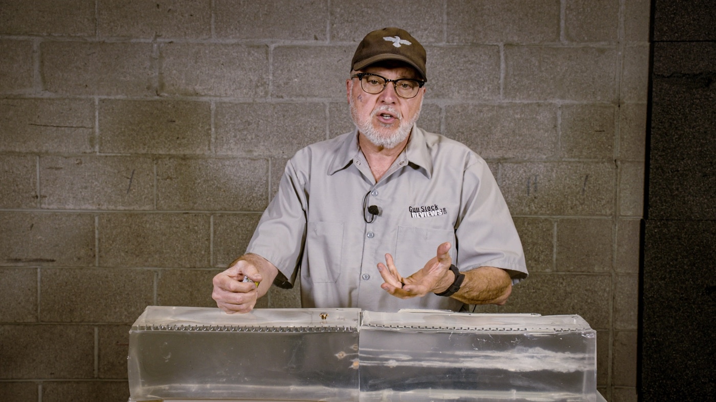 In this photo, the author is standing over Clear Ballistics gel into which he shot multiple bullets from the Federal Punch line of ammunition. The bullets have expanded in the ballistic testing medium.