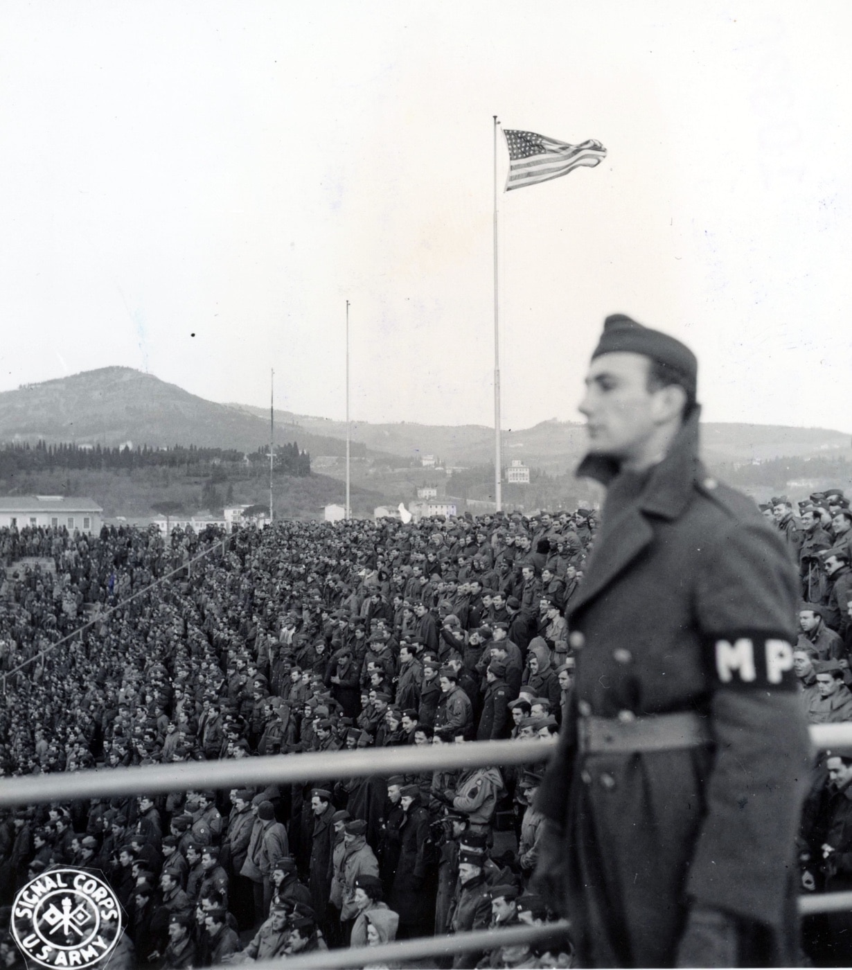 american flag old glory flying over stadium spaghetti bowl italy football game in world war 2