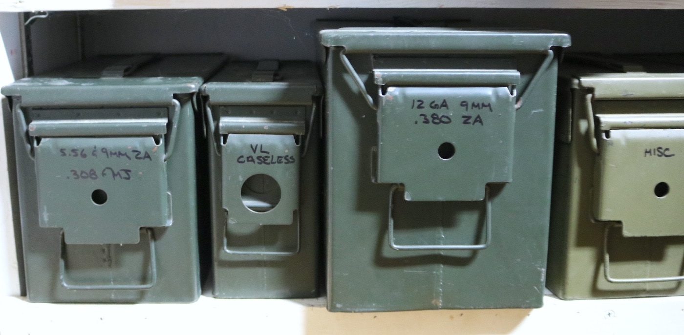 Here the author shows how to properly store ammo using military-style cans. He has a special storage area and marks each can with the type of ammo being stored. You could also mark how much ammo is stored in each container, though a separate log indicating the amount of ammunition on hand may be easier to maintain.