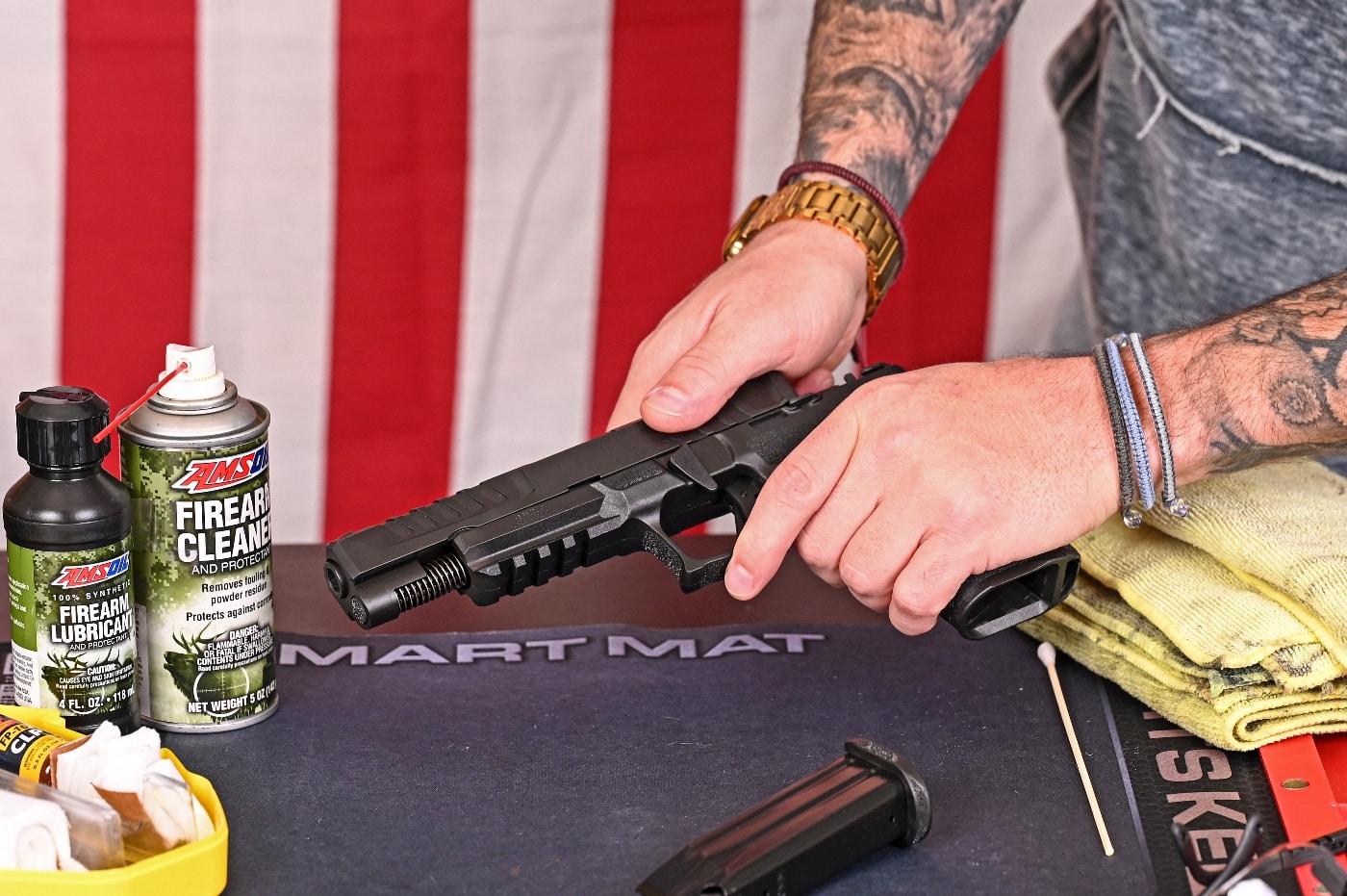 In this photo, the author disassembles his firearm so he can start cleaning it. Knowing how to clean a gun is the responsibility of gun owners. Be sure to check the gun owner's manual that came with it at purchase. Handgun malfunctions are rare with properly maintained firearms from reputable brands like Springfield Armory. A basic cleaning after each range trip can give you a lifetime of trouble-free shooting.