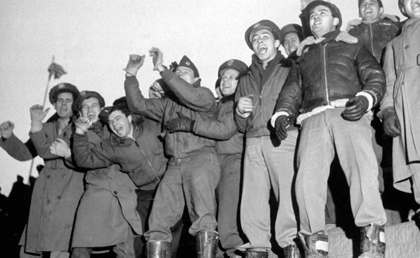 fans of 12th air force football team in the stadium cheering players during spaghetti bowl 1945