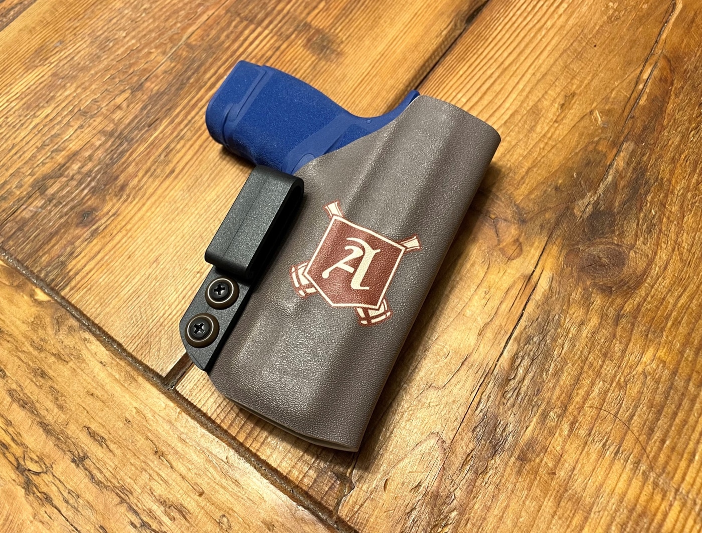 In this photo, we see the author's completed holster. It is an appendix inside-the-waistband rig that he made specifically for his Hellcat. The rig has several things that make it unique including the incorporation of The Armory Life logo. It beats having to buy a holster that would cost extra for the customization. Follow this tutorial and you can do the same for your Springfield, Glock or M&P. It can be made for pistols with and without an accessory rail.