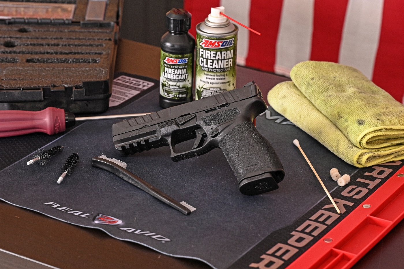 The author shows his gun cleaning area in this photo. His Springfield Echelon is on a cleaning mat along with brushes, solvent and other tools. These simple tools will allow you to clean the majority of handguns including revolvers with ease. The same oils, solvents, patches and brushes can be used to clean the barrel, slide and frame of virtually any handgun.
