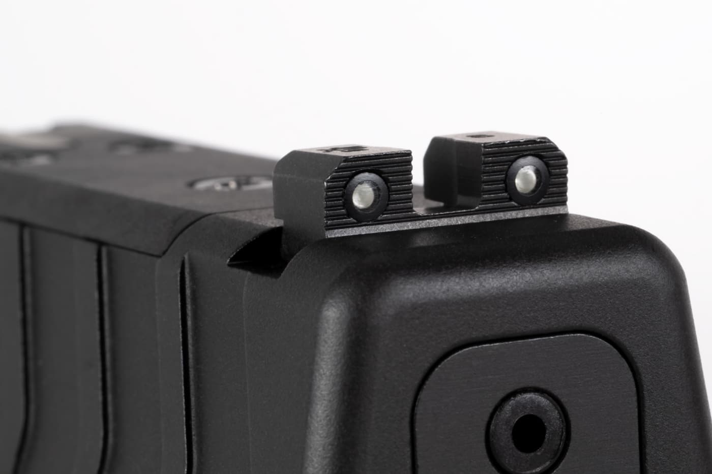 The rear sight has a pair of tritium vials that glow in the dark. The black, serrated face reduces glare in bright light. The sight also is standard height and not suppressor-height sights. For most shooters, this is perfect as few people attach a silencer to their concealed carry gun. 