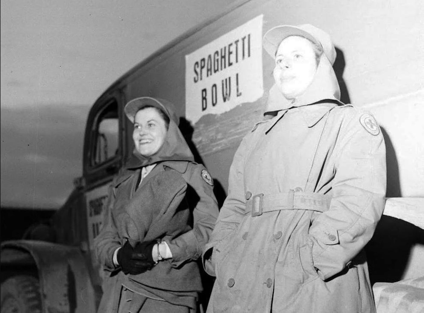 red cross girls workers serving coffee doughnuts at spaghetti bowl american football game in world war 2