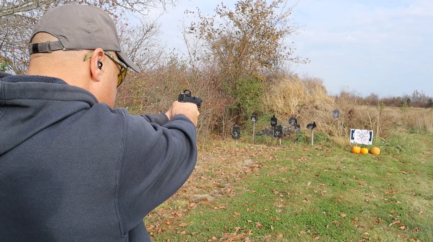 In this photo, the author is testing the red dot on the shooting range while shooting his Springfield Armory 9mm pistol. The lens of the RMSd is a reflex type with 1x magnification, ensuring a clear, true-to-life view. The low parallax and the coatings – Si02 Quartz and anti-reflection – enhance the clarity without any colored tint. It can be used on many other guns like the offerings from Glock, SIG Sauer and Smith & Wesson. The red dot performs well on the Springfield.