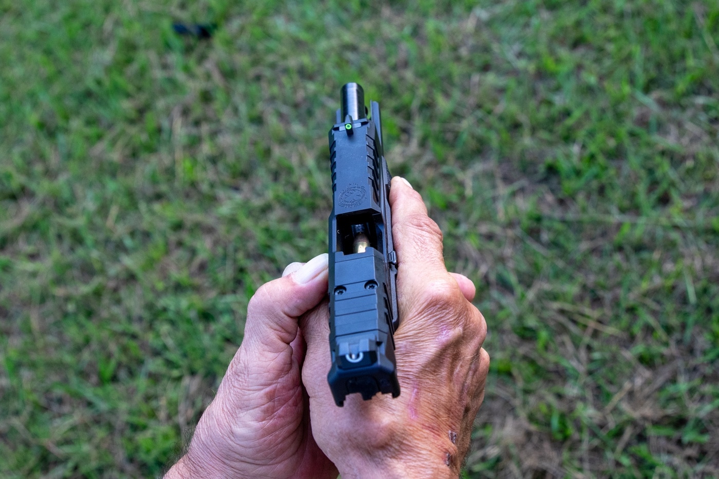 The Echelon is a full-sized pistol. In this photo you can see the front and rear sights — the u-dot sights that are the same as what is on the Hellcat. The front sight has a tritium insert with a rear U-notch sight. Also vis is the optic mounting area that allows you to add a Trijicon RMR or other reflex sight. The Echelon comes standard with this.