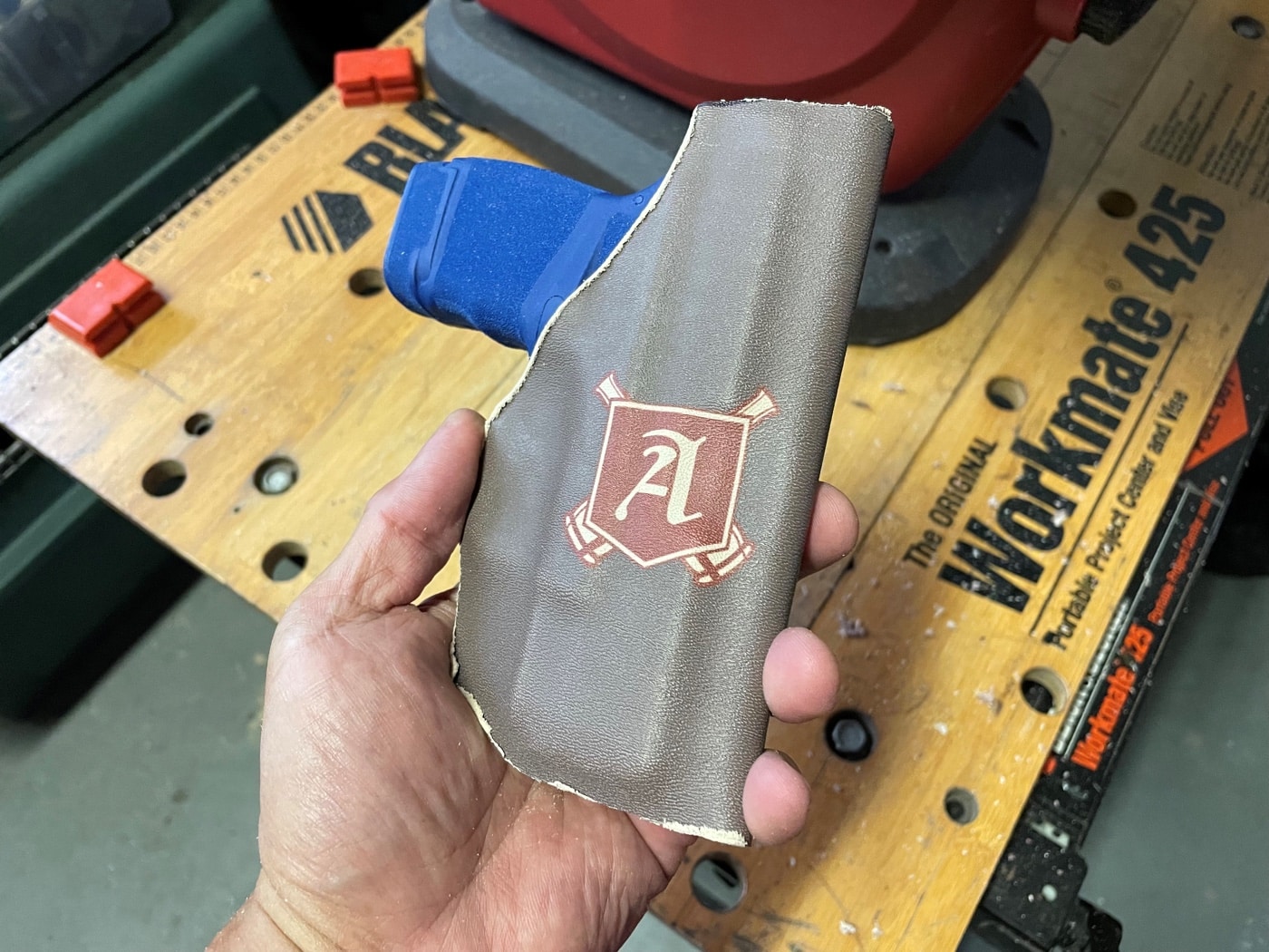 The author trims the extra material from the formed holster. This will leave rough edges, but don't worry. Follow the guide step by step and you will have the chance to clean those up to make them look and feel better. 