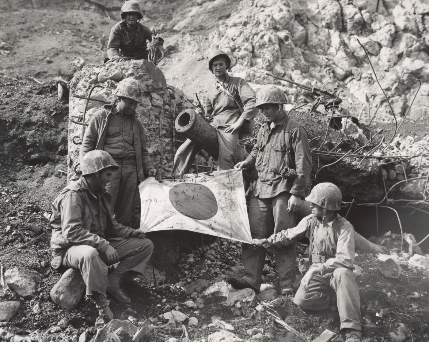 Marines of the 5th Marine Division with a captured Japanese flag on Iwo Jima. Image: Staff Sgt. M.A. Cornelius/U.S. Marine Corps