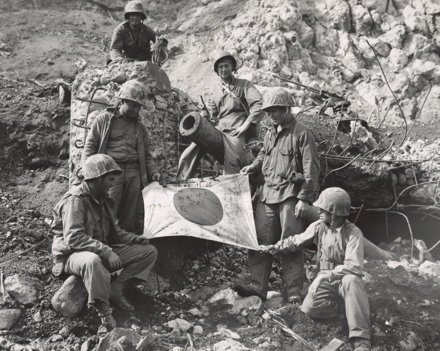 Marines of the 5th Marine Division with a captured Japanese flag on Iwo Jima. Image: Staff Sgt. M.A. Cornelius/U.S. Marine Corps