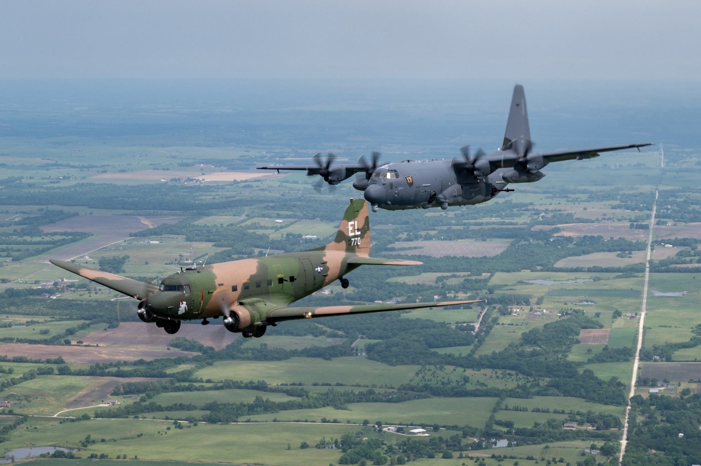In this photo we see a AC-47 and AC-130 flying in formation in 2021. The memorial flight was in memory of Airman 1st Class John Levitow who was awarded the Medal of Honor. 